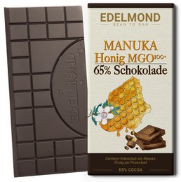 Dark chocolate bar with 65% Manuka honey and cocoa. Rectangular shape, brown color, and Edelmond branding.