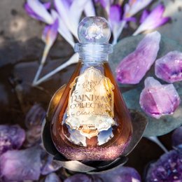 Amethyst Embrace Sparkling Chakra Bath Oil, Vanilla Lavender - A luxurious bath oil with a blend of vanilla and lavender scents, packaged in a decorative glass bottle.
