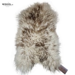 Soft, curly sheepskin throw in white and brown colors, available in sizes S, M, L, and XL.