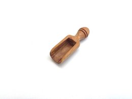Small olive wood salt scoop, 6 cm long, for serving and seasoning.