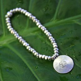 Meaningful silver bracelet with a large Om