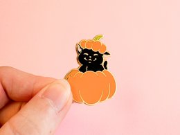  Gold plated hard enamel pin with a cat astronaut design. Suitable for wearing as a brooch.