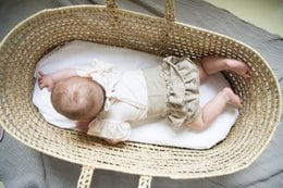Dark beige bloomers with ruffles for baby girls, available in sizes newborn to 24 months.