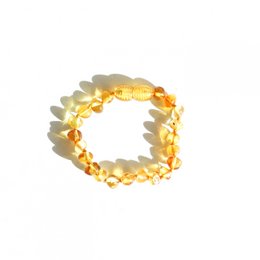 Amber baby bracelet - Honey, a beautiful and natural piece of jewelry for kids. The bracelet is made of round amber beads in a warm honey color, creating a soft and soothing look.