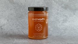 A jar of Bio Thyme Honey from Crete, 790gr. The honey has a rich, golden color and is made from the nectar of thyme flowers grown in the Cretan region.
