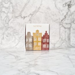 Gracht soap with bergamot, grapefruit, and patchouli scents, packaged in a colorful box with a cityscape design.