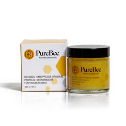 Oleogel skin care original is a cream product in a yellow jar with the PureBee logo. The cream is designed for skin care and nourishment.