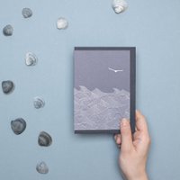 Simple mourning card seagull over sea in blue made from environmentally friendly recycled paper - stylish condolence card without text