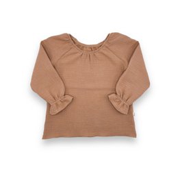 Tan long-sleeved blouse with a gathered neckline, paired with floral print flared pants for a stylish kids' outfit.