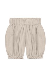  Beige children's shorts with a relaxed, balloon-style silhouette. Made from a lightweight, breathable fabric for comfortable wear.