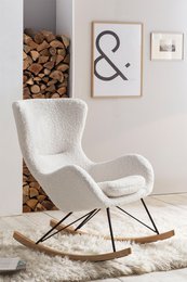 Plush white rocking chair with a soft, furry texture and a curved, rocking base for a comfortable, cozy seating experience.