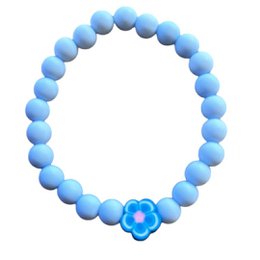 A children's bracelet featuring a string of blue beads with a small flower charm.