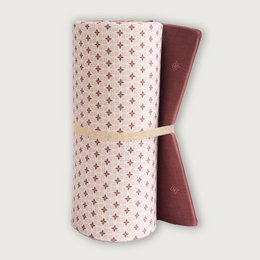  A burgundy and pink patterned yoga mat with a soft, textured surface. Ideal for yoga, pilates, and other floor exercises.