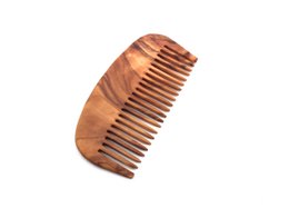 Classic olive wood comb with fine teeth for gentle hair detangling and styling.