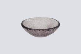  Small lilac-colored ceramic bowl with a round, shallow shape and a textured surface.