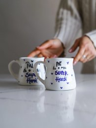  White ceramic mug with text "My super hero" and hand-drawn stars.