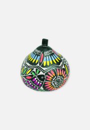 Colorful storage basket with vibrant floral patterns and a round shape.