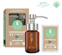 Organic bergamot shower foam in a glass bottle with a silver pump head. The product contains natural ingredients and is suitable for use as a shower gel.
