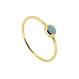 Elegant gold and silver statement ring with a turquoise stone.