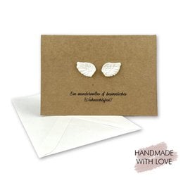 Folding Christmas cards with plaster figures, angel wings, Christmas tree, Santa, handmade kraft paper design.