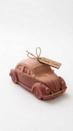  Vintage car-shaped candle, dusty rose pink wax, retro automobile design, decorative scented candle.