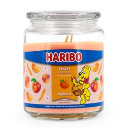  Scented candle with a peach fragrance, packaged in a glass jar with a Haribo brand logo and imagery.