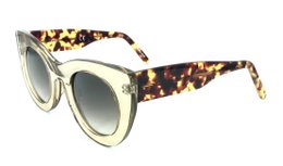 Translucent tortoiseshell-patterned sunglasses with a bold, cat-eye frame shape.