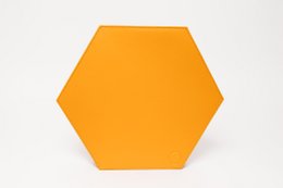 Bright yellow hexagonal clutch with a strap for easy carrying.