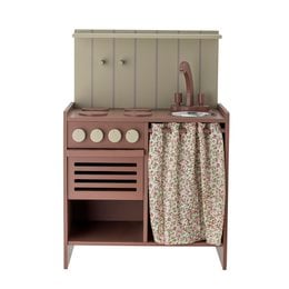 A miniature wooden play stove in a neutral brown color, with a curtain and storage space, suitable for children's play kitchens or pretend play.