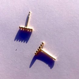  Elegant gold-tone stud earrings with a bold blue spike design. Made of high-quality metal for a durable and stylish look. Suitable for casual or formal wear.