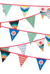  Colorful party flags with various patterns and shapes, including circles, triangles, and checkered designs. The flags are hung across a doorway, creating a festive and celebratory atmosphere.