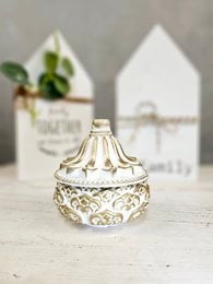 Ornate white jewelry box with intricate gold detailing and a decorative lid.