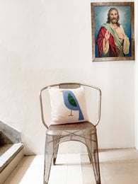 Soft cotton knit pillow cover with punchneedle embroidery of a blue bird design, available April 1st.