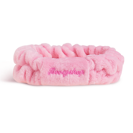 Pink fuzzy headband with textured ruffle design.