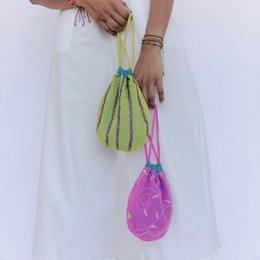 Fluor yellow and fluor pink pouch bag with a unique, modern design. Made of durable materials, perfect for everyday use.