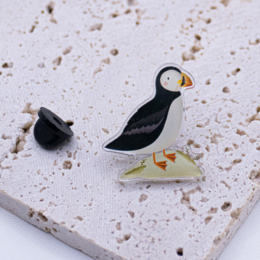  Decorative acrylic duck figurine with a black hat accessory.