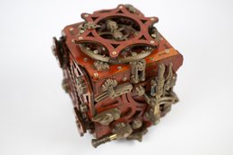 Intricate mechanical puzzle game with gears, cogs, and wooden components in a rustic, industrial design.