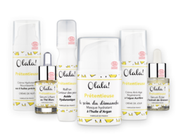 Cream-colored products from the Pretentious Range, including a variety of skincare items. The products feature a minimalist design with floral accents.