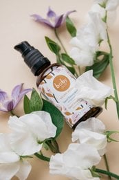 Organic baby body oil with a sweet, calming fragrance. Features a glass bottle with a dropper for easy application. Suitable for delicate baby skin.