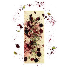 White chocolate bar with cherry, pistachio, and gold leaf accents. Gourmet chocolate gift.