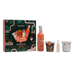 This beauty gift set includes a variety of products for a radiant complexion. The set contains a facial oil, face mask, and face cream in a vibrant, patterned gift box.