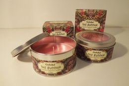 Scented candle Goloka The Buddha, round tall candle, made of wax, floral scented, in a decorative tin container.