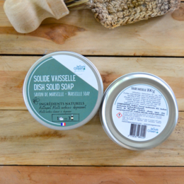  Solid dish soap made with natural ingredients, in a round, white container. The product is labeled as "Solide Vaisselle Dish Solid Soap" and is part of the Kitchen Cleaners category.