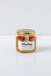A 60g jar of all-natural honey with a vibrant orange color and a sweet, floral aroma.