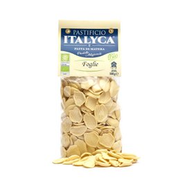Organic artisan pasta made in Italy, featuring a yellow packaging with the brand name "Pastificio Italyca" and the product name "Foglie". The pasta appears to be shaped like leaves or flat pieces.