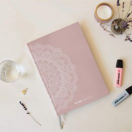  A medium-sized, undated weekly planner with a mandala design. The planner features lined pages for scheduling and note-taking.
