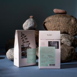 Peppermint tea, loose leaf, green and white packaging, herbal tea, natural ingredients.