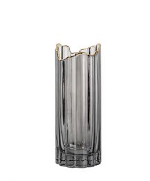 A tall, cylindrical glass vase with a copper rim. The vase has a smoky, gray color and a textured, ribbed design.