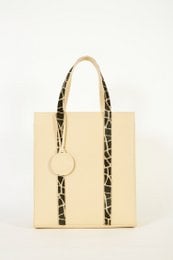 Beige tote bag with leopard print accents, featuring a structured rectangular shape and dual handles.