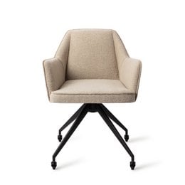 Upholstered dining chair with swivel base in a neutral beige fabric. Features a modern, minimalist design with a sturdy metal frame.